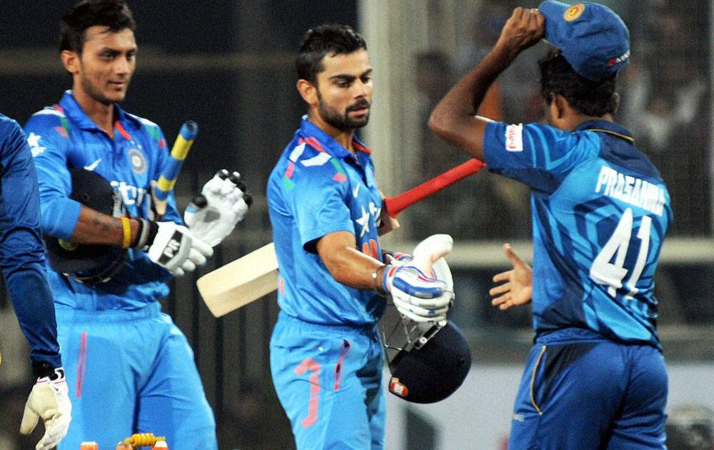 Captain Virat Kohli and A Patel celebrate after beating Sri Lanka in the 5th and final ODI by 5-0 in Ranchi.