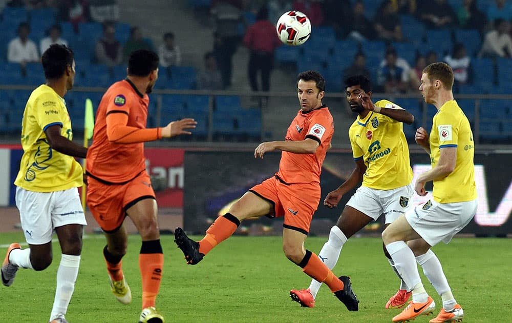 Players vie for the ball during the Delhi Kerala football match being played during the Hero Indian Super League at Jawaharlal Nehru Stadium in New Delhi.