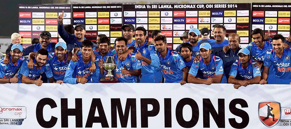 INDIAN CRICKETERS CELEBRATE WITH TROPHY AFTER WINNING THE SERIES AGAINST SRI LANKA IN RANCHI.