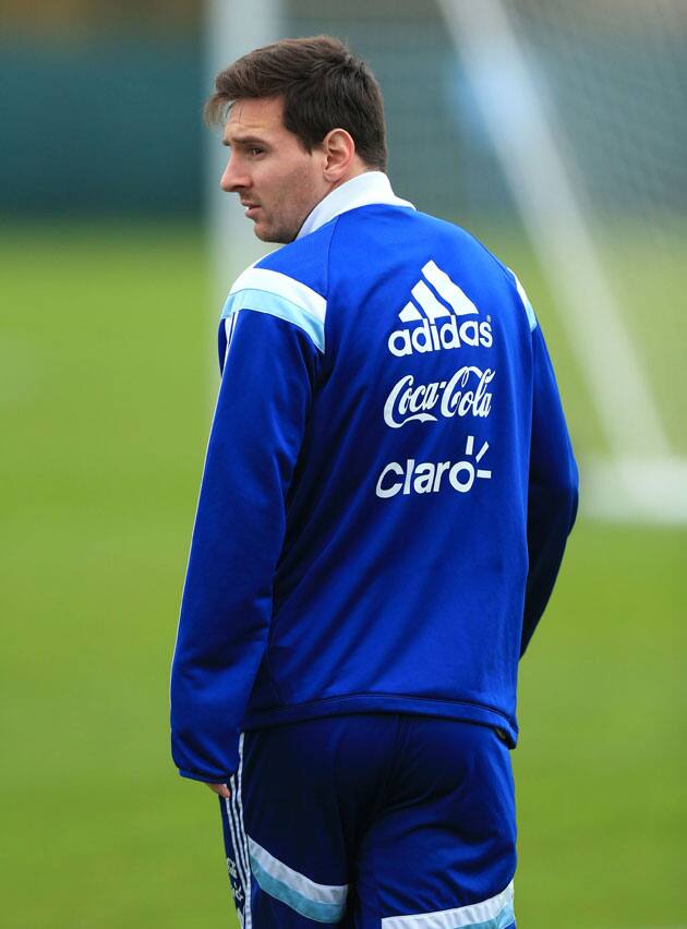 Argentina's soccer star Lionel Messi, looks across the pitch during a training session at Carrington, Manchester England.