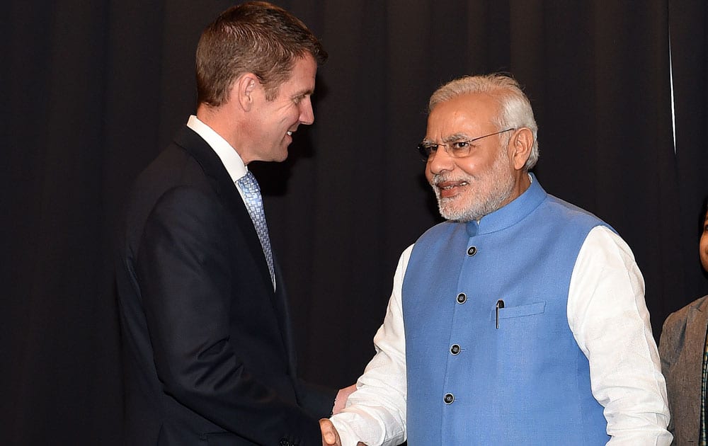 Prime Minster of India Narendra Modi, right, shakes hand with Australia's New South Wales Premier Mike Baird before their meeting in Sydney.