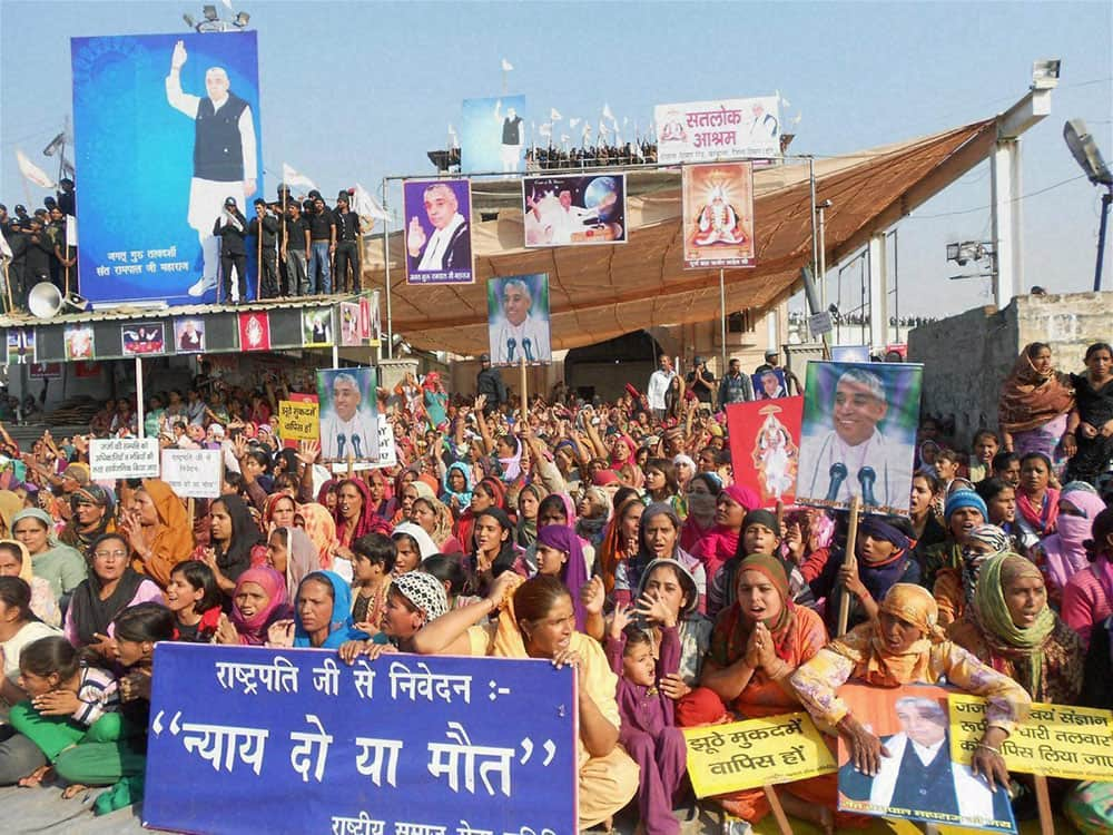 Followers sheild the Satlok Ashram of Sant Rampal in Hisar.