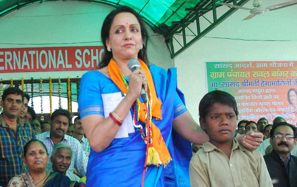 Bollywood actress & BJP MP Hema malini speaks while officially adopting village Rawal near Mathura on Monday under the Prime Ministers Sansaad Adarsh Gram Yojana.