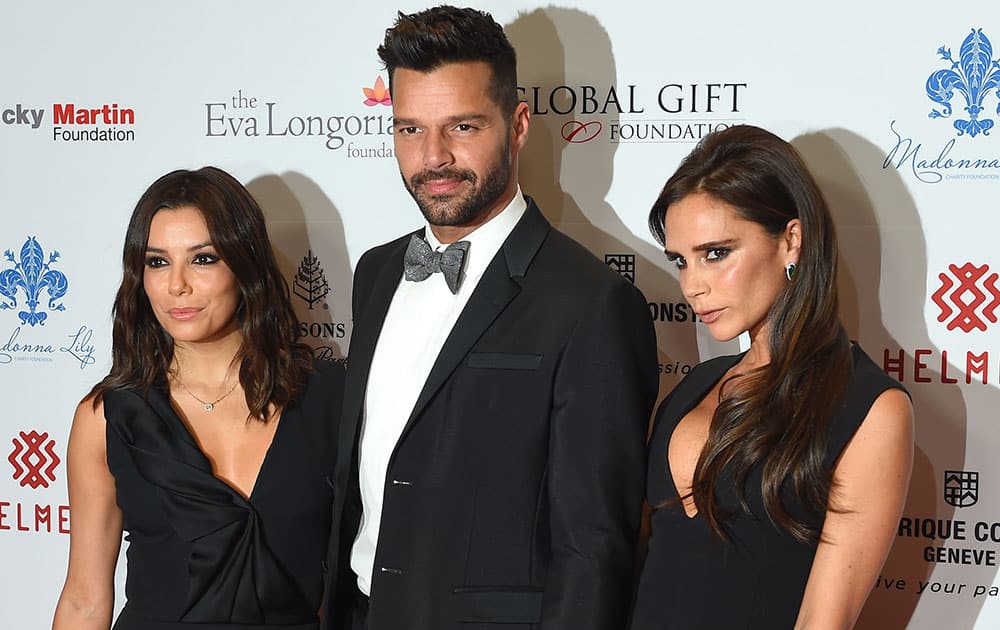 Actress Eva Longoria, singer Ricky Martin and fashion designer Victoria Beckham pose for photographers upon arrival at The Global Gift Gala in London.