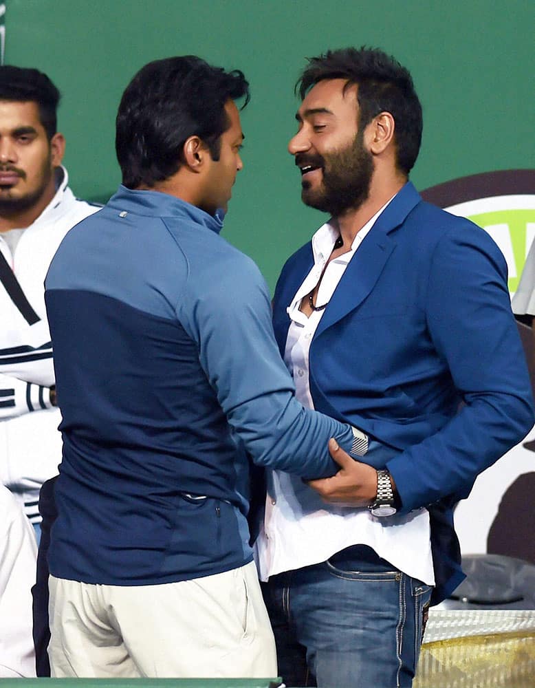 Tennis Player Leander Adrian Paes with Actor Ajay Devgn during the Champions Tennis league in New Delhi.
