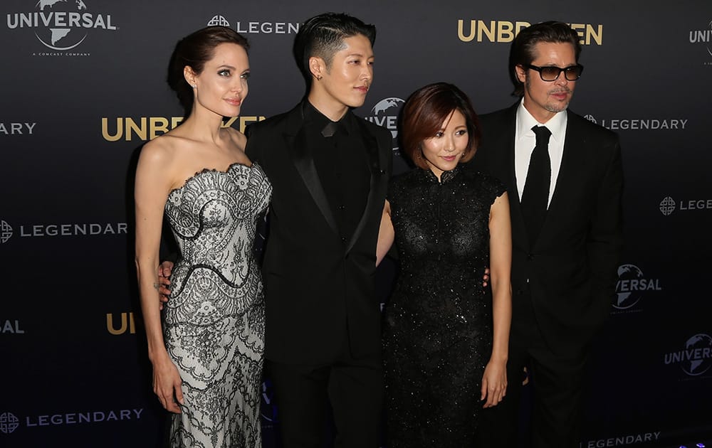 Movie star Angelina Jolie, director of 'Unbroken', poses for photos with Mayavi, Melody Ishihara and Brad Pitt at the World Premiere of the film in Sydney.