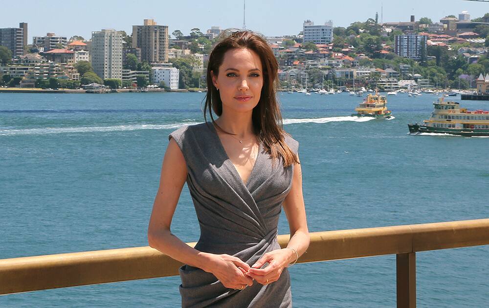 Angelina Jolie, who directed and produced the film 'Unbroken,' poses for a photo after a press conference following the movie’s world premiere in Sydney, Australia.