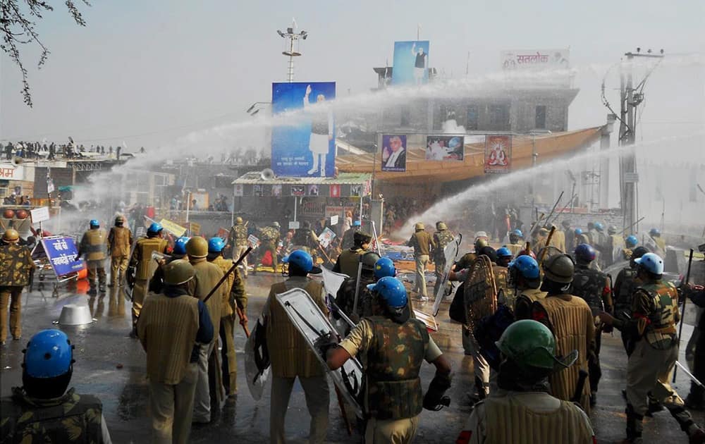 Police and Sant Rampals followers indulge in violent clashes at Satlok Ashram in Hisar. Supporters of Rampal indulged in clashes with the police to resist his arrest. 