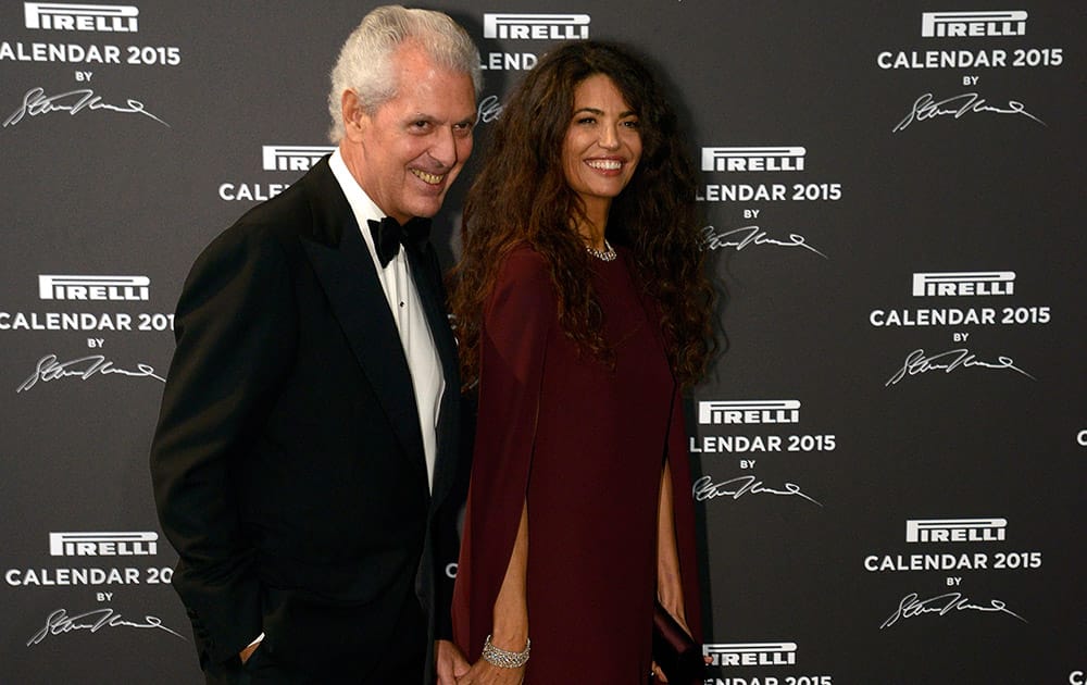 CEO Pirelli Group Marco Tronchetti Provera and his wife Afef Jnifen pose for the photographers as they arrive at the Gala Dinner on the occasion of the presentation of the Pirelli 2015 Calendar by Steven Meisel, unveiled in Milan.