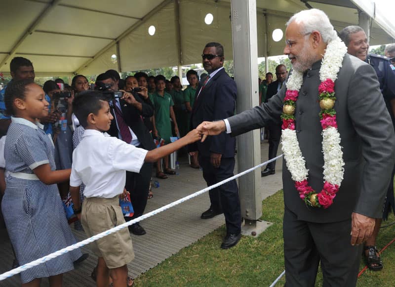 PM Narendra Modi greeting the people during the traditional welcome ceremony, in Suva, Fiji.