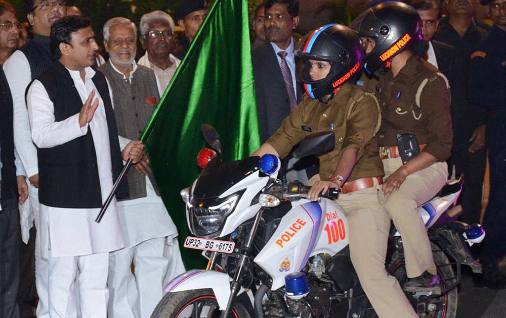 Uttar Pradesh Chief Minister Akhilesh Yadav flagging off new police bikes on the birthday of Rani Laxmi Bai at his official residence in Lucknow.