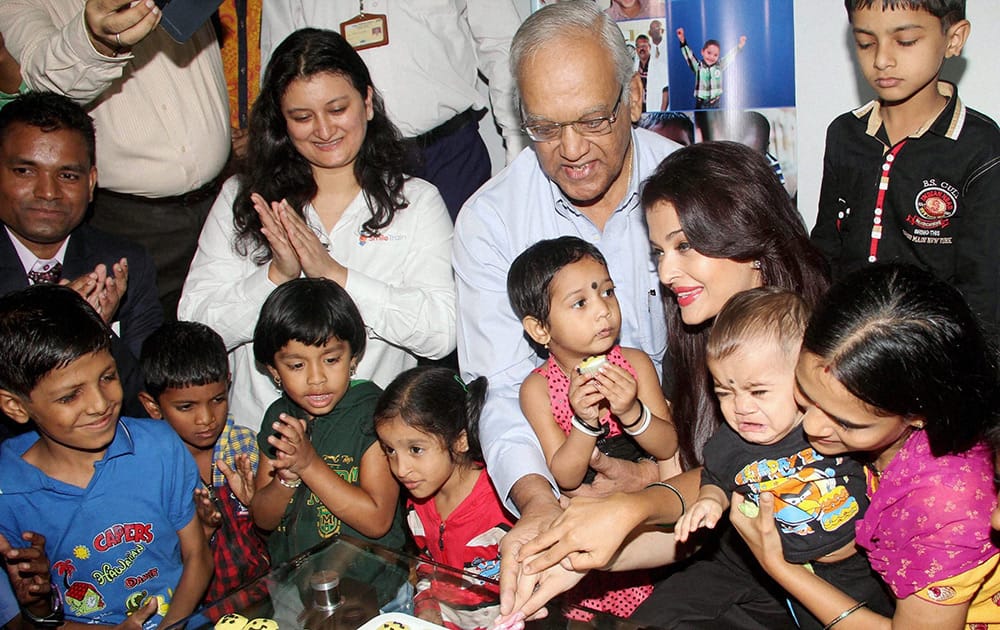 Aishwarya Rai Bachchan celebrates her father Krishnaraj Rais birthday with children with cleft lips in Mumbai. Aishwarya gifted surgeries to the children for the lips to celebrate the occasion.