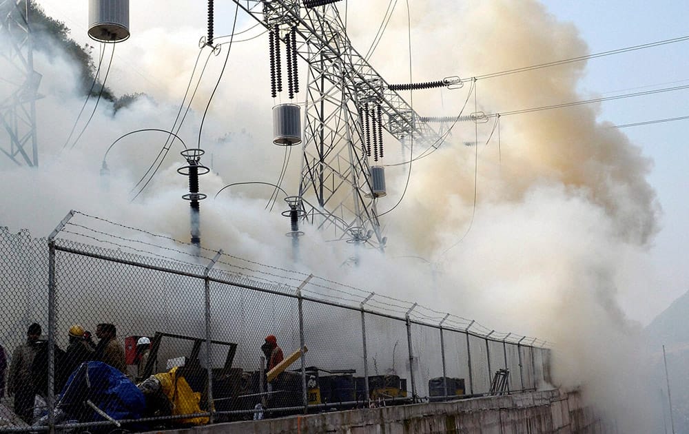 Smoke billowing from 240 MW URI II power project during a major fire, in Uri.