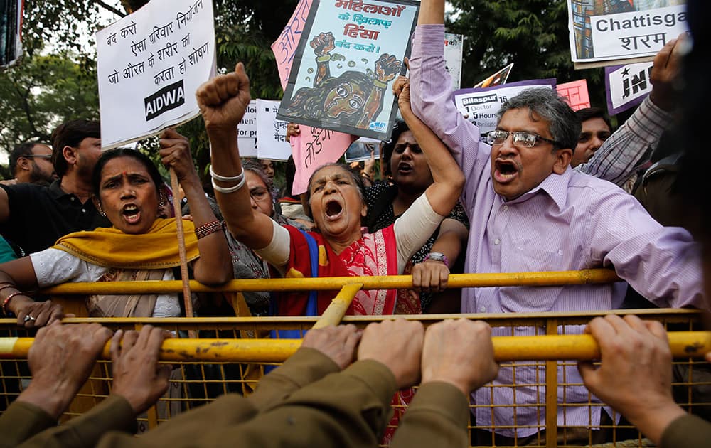 Activists from various student unions and non-governmental organizations shout slogans against the Chhattisgarh government outside Chhattisgarh house, in New Delhi.