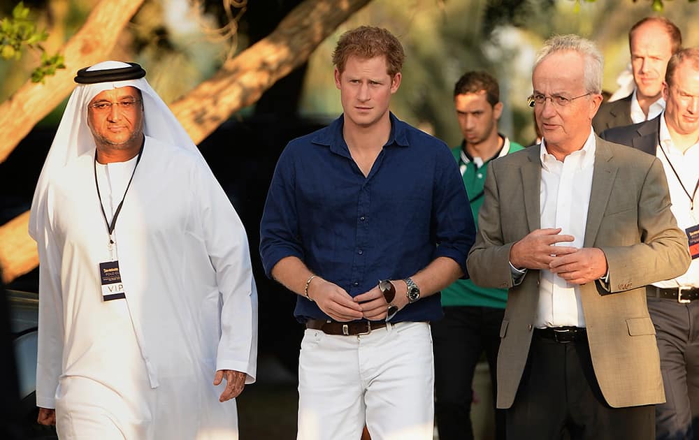 Abu Dhabi official Matar Al Yabhouni, from left, Prince Harry and Chairman of Sentebale Philip Green attend the Sentebale Polo Cup presented by the Royal Salute World Polo at the Ghantoot Polo Club in Abu Dhabi, United Arab Emirates.