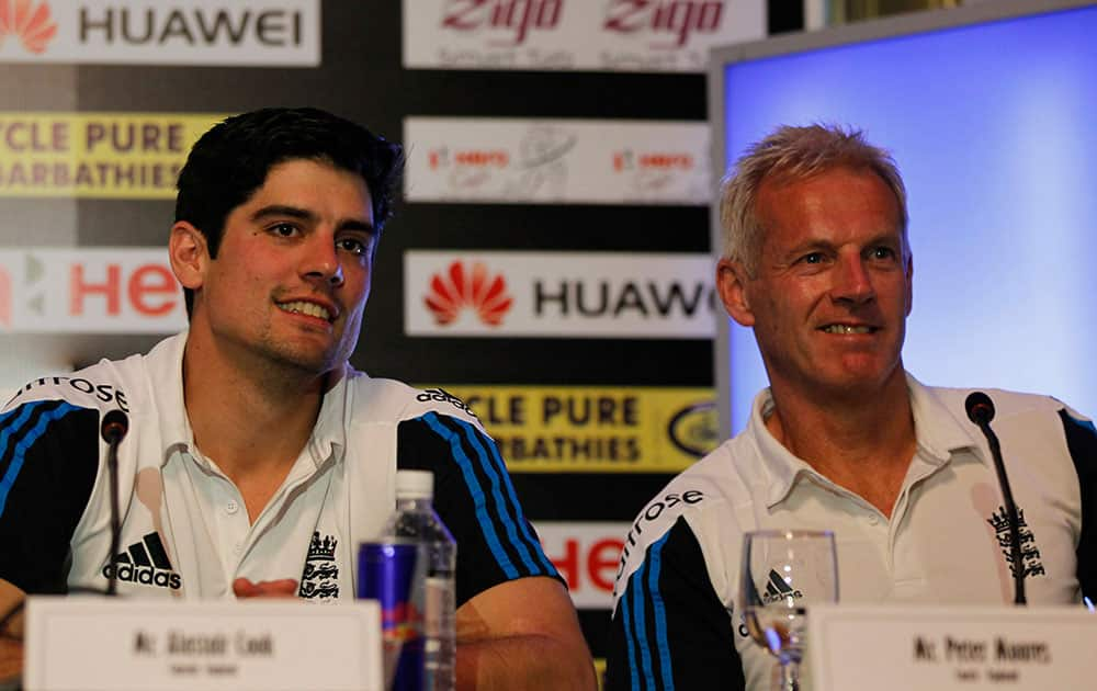 England's cricket captain Alastair Cook left, and team coach Peter Moores listen to a question during a media interaction ahead their one day international series against Sri Lanka in Colombo, Sri Lanka.