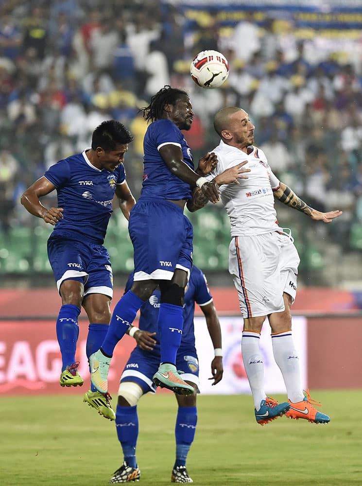 Chennaiyi FC and Pune City FC players vie for the ball during their ISL match in Chennai.