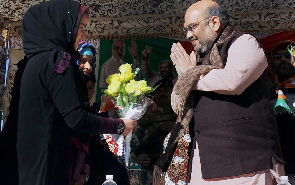 BJP President Amit Shah is greeted at an election rally in Banihal, J & K.