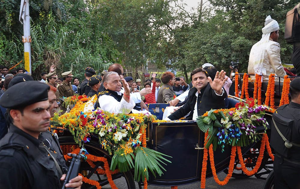 SP chief Mulayam Singh Yadav with his son and UP CM Akhilesh Yadav riding a Royal Buggy, brought from London, at an event to celebrate his 76th birthday in Rampur.