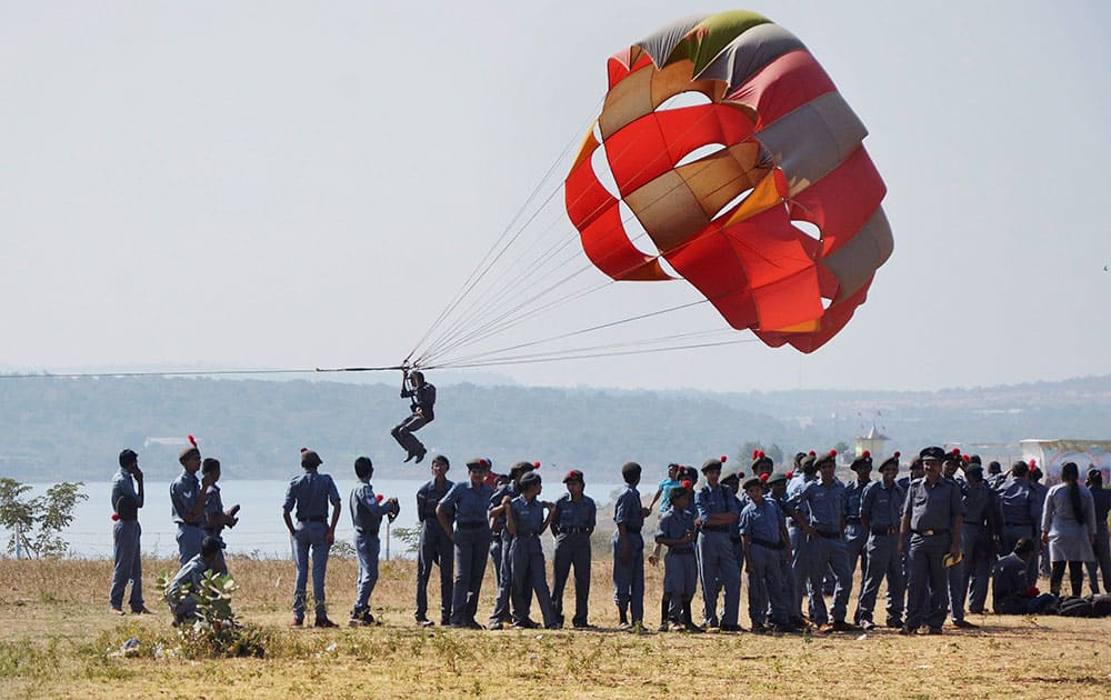 NCC cadets from Madhya Pradesh & Chhattisgarh perform parasailing during the 66th NCC Day celebration in Bhopal.
