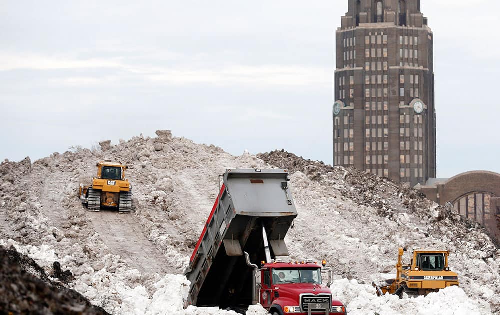 A dump truck unloads snow at the Central Terminal that was removed from south Buffalo after heavy lake-effect snowstorms.