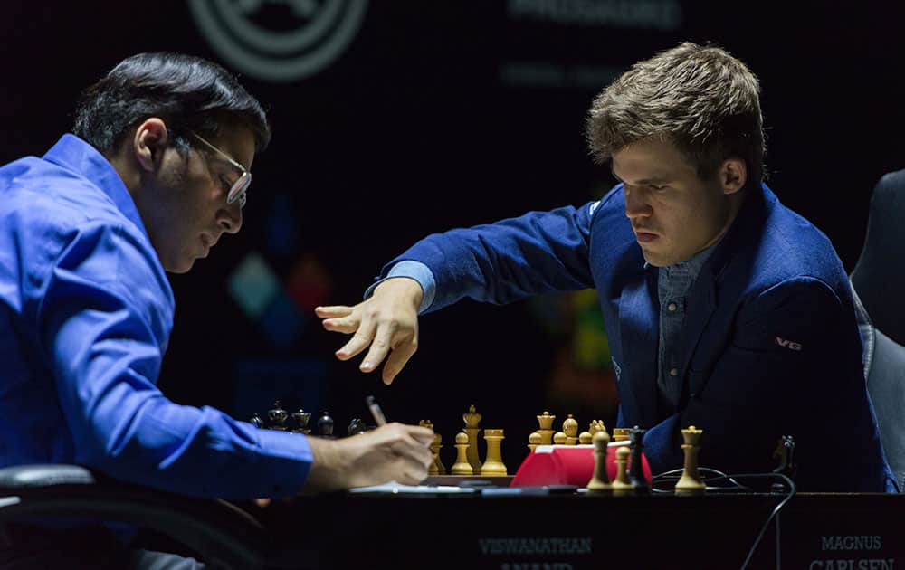 Norway's Magnus Carlsen, right, currently the top ranked chess player in the world, plays his 11th game against India's former World Champion Vishwanathan Anand, at the FIDE World Chess Championship Match in Sochi, Russia.