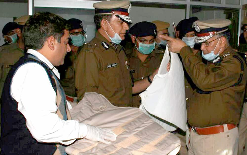 Haryana DGP S N Vashist inspecting the bullet proof jacket which recovered from Ramlals Satlok Asharam in Hisar.