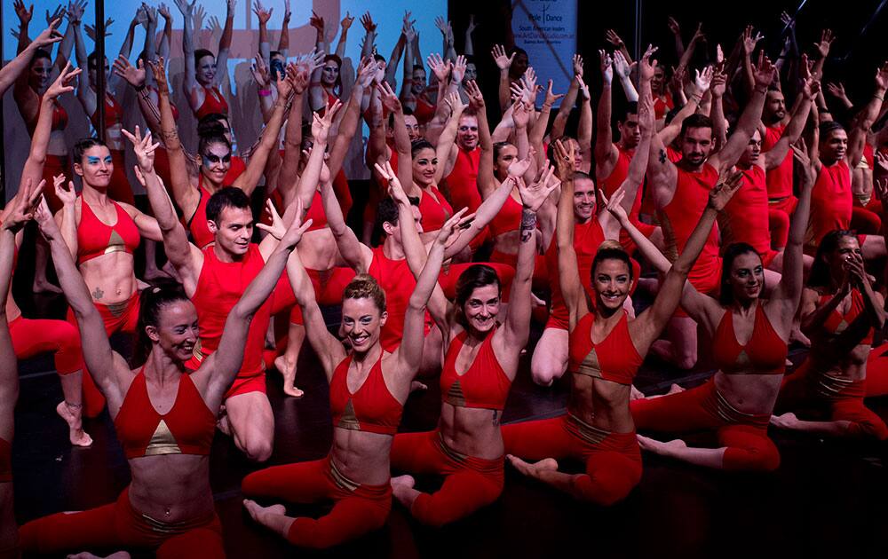 Participants of Miss Pole Dance South America 2014 and Pole Dance Argentina 2014 competitions, pose for a group photo before the start of the competition in Buenos Aires, Argentina.