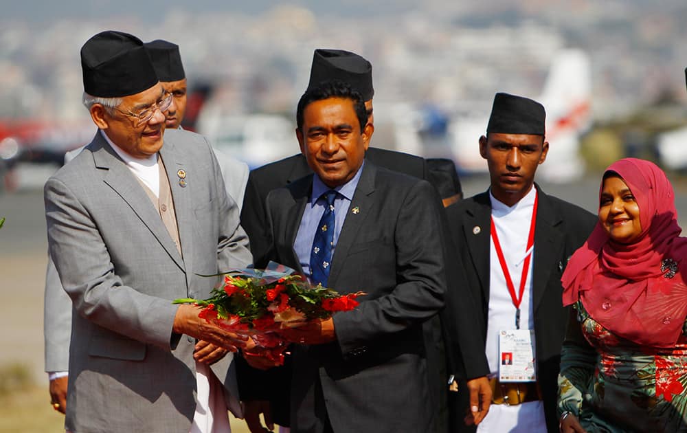 Nepalese Home Minister Bam Dev Gautam, welcomes Maldives President Abdulla Yameen, as he arrives at the Tribhuwan Airport to attend the 18th summit of South Asian Association for Regional Cooperation (SAARC) in Katmandu, Nepal.