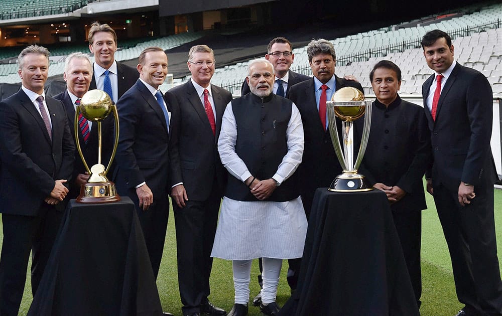 PRIME MINISTER NARENDRA MODI AND HIS AUSTRALIAN COUNTERPART TONY ABBOTT WITH LEGENDARY CRICKETERS OF BOTH COUNTRIES DURING A FUNCTION AT MELBOURNE CRICKET GROUND IN MELBOURNE.