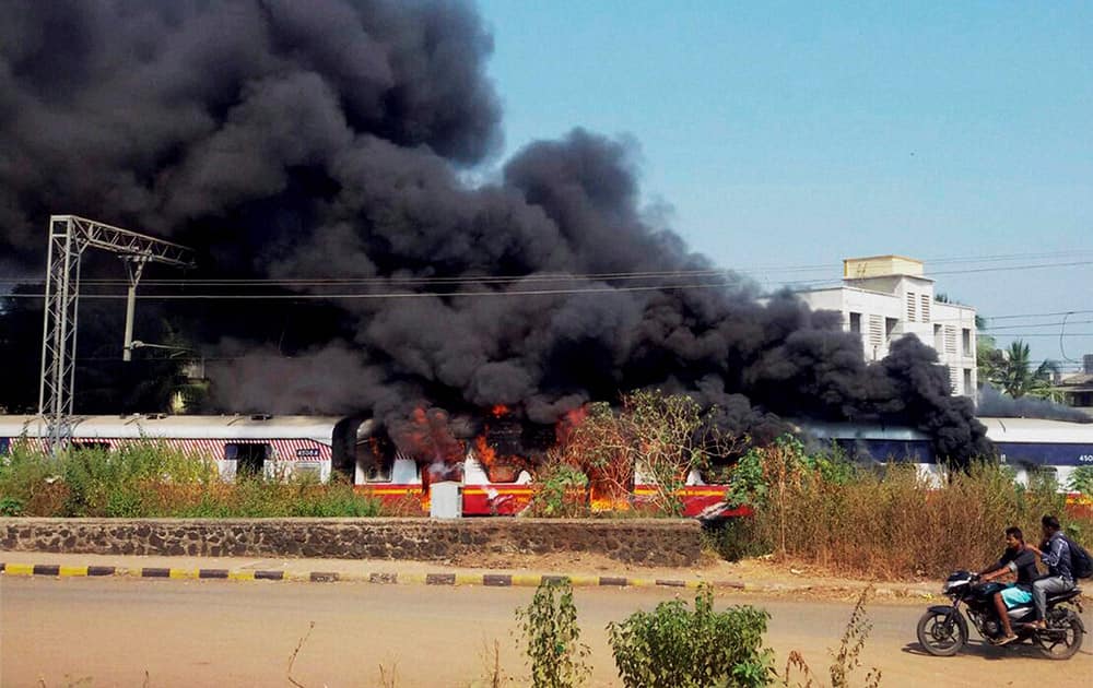 Fire breaks out in a compartment of a train standing at Badlapur station near Thane in Mumbai.