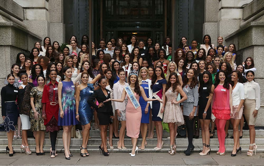 Miss World 2013 Winner Megan Young, centre arms outstretched, poses for photographs with Miss World Contestants on the steps of a hotel next to London County Hall in Westminster, central London.