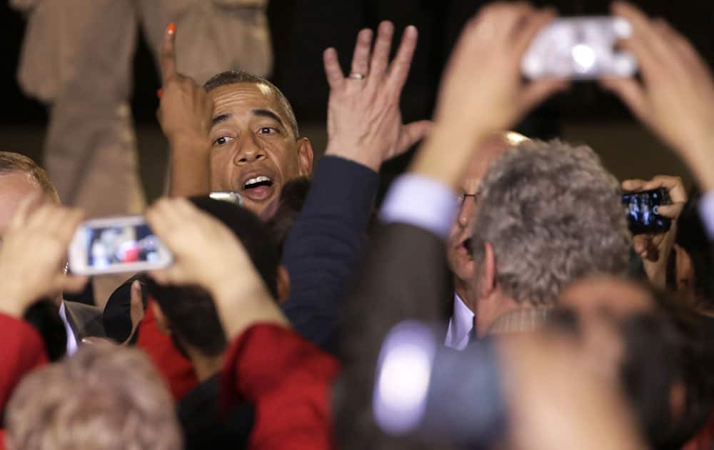 President Barack Obama works the crowd after addressing a meeting with community leaders about the executive actions he is taking to fix the immigration system, in Chicago. 