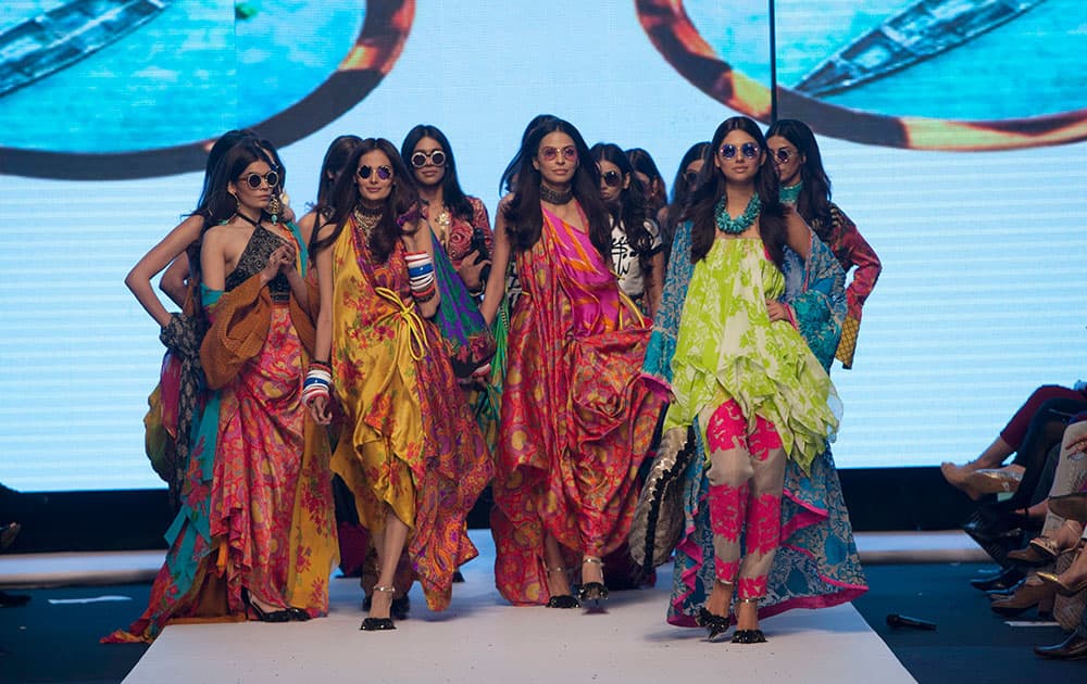 Pakistani models present creations by designer Sana safi Naz, during Pakistan Fashion Week, in Karachi.