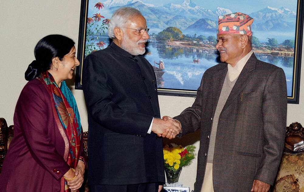 PM Narendra Modi shakes hands with Nepalese President Ram Baran Yadav at a meeting in Kathmandu.