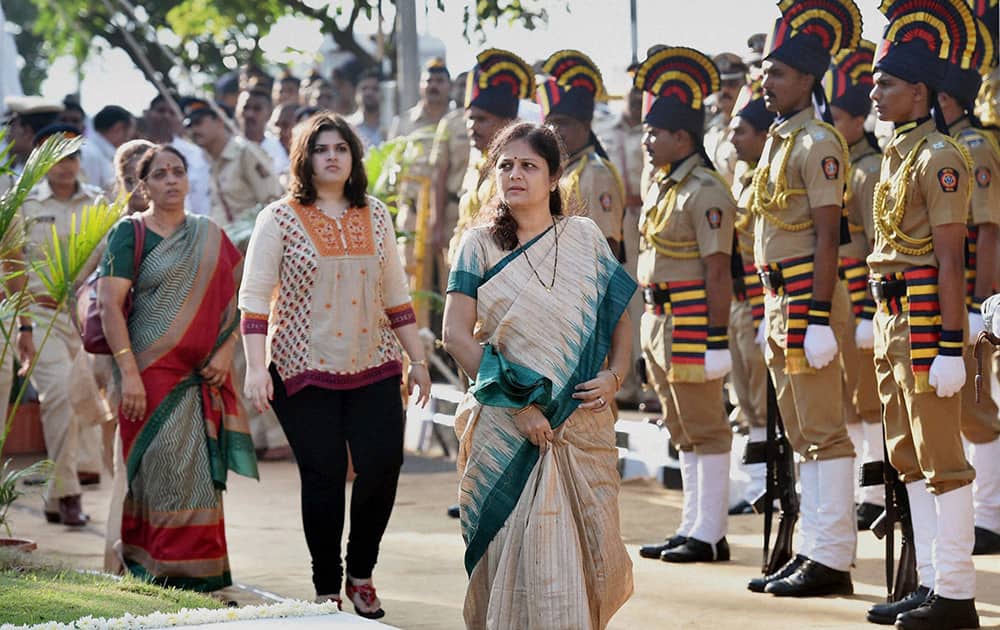 Wife Smita Salaskar and daughter Divya of slain encounter specialist Vijay Salaskar pay tributes to the victims of 26/11 Mumbai terror attacks on the sixth anniversary of the gruesome incident, in Mumbai.