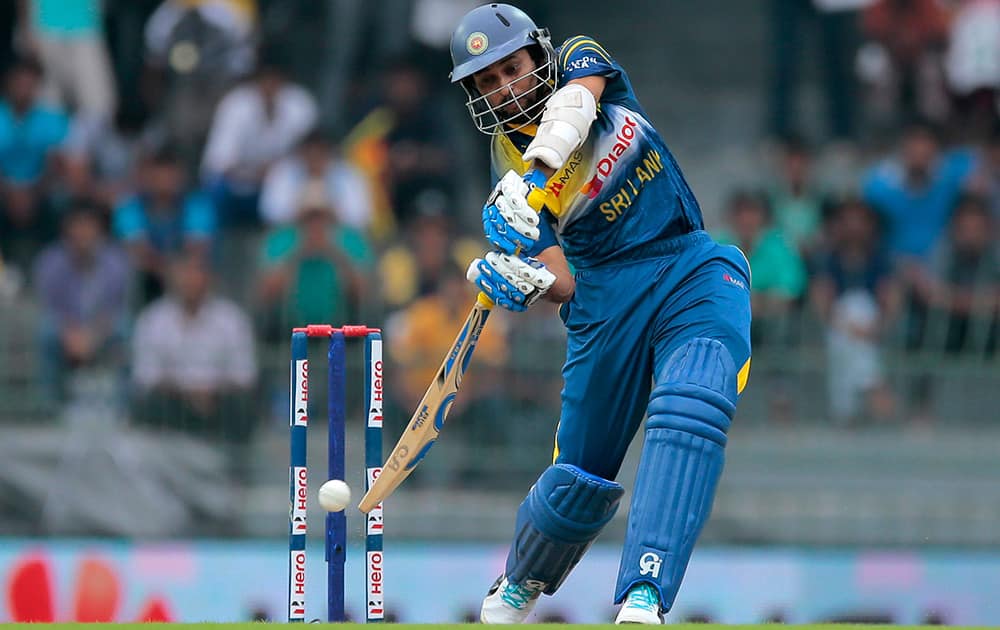 Sri Lankan cricketer Tillakaratne Dilshan plays a shot during the first one day international cricket match between Sri Lanka and England in Colombo, Sri Lanka.