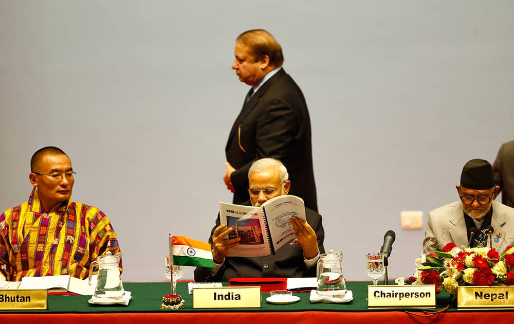 Pakistani Prime Minister Nawaz Sharif walks past Indian Prime Minister Narendra Modi during the 18th summit of the South Asian Association for Regional Cooperation (SAARC) in Katmandu, Nepal.