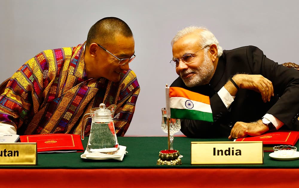 Bhutanese Prime Minister Tshering Tobgay, speaks with Indian Prime Minister Narendra Modi during the 18th summit of the South Asian Association for Regional Cooperation (SAARC) in Katmandu, Nepal.