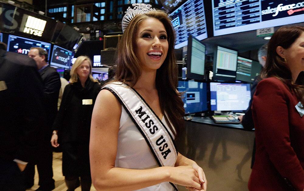 Nia Sanchez, Miss USA 2014, who represented Nevada, visits the trading floor after participating in opening bell ceremonies of the New York Stock Exchange.