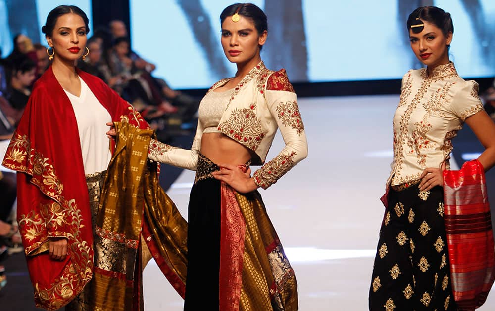 Pakistani models present creations by designer Sanam Chaudhri, during Pakistan Fashion Week.