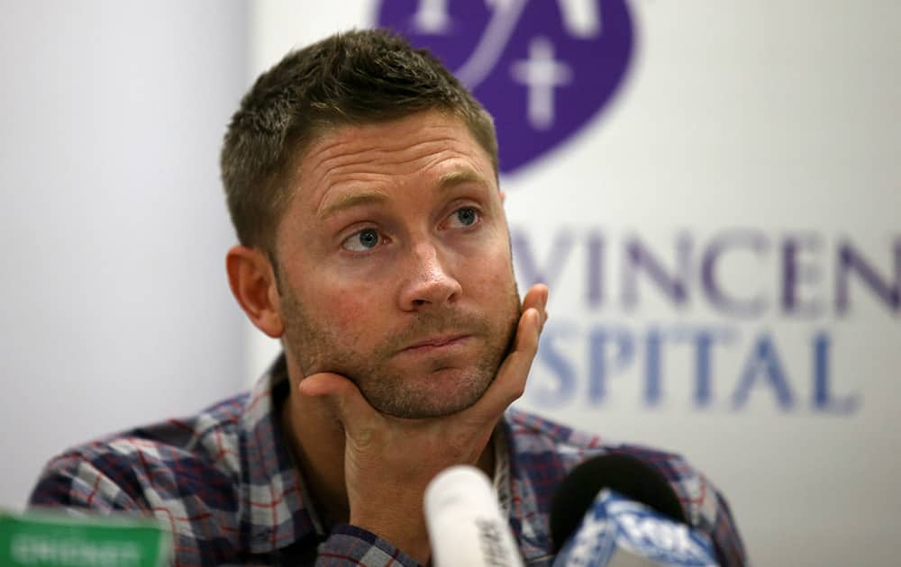 Australia cricket captain Michael Clarke touches his face just before reading a statement following the death of fellow cricketer Phillip Hughes during a press conference at St. Vincent's Hospital in Sydney.
