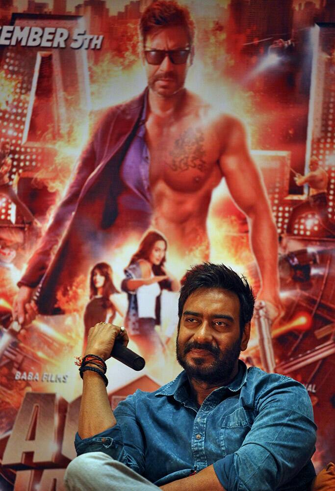 Bollywood actor Ajay Devgan listens to a question during a press conference organized to promote his forthcoming movie 'Action Jackson' in Ahmedabad.