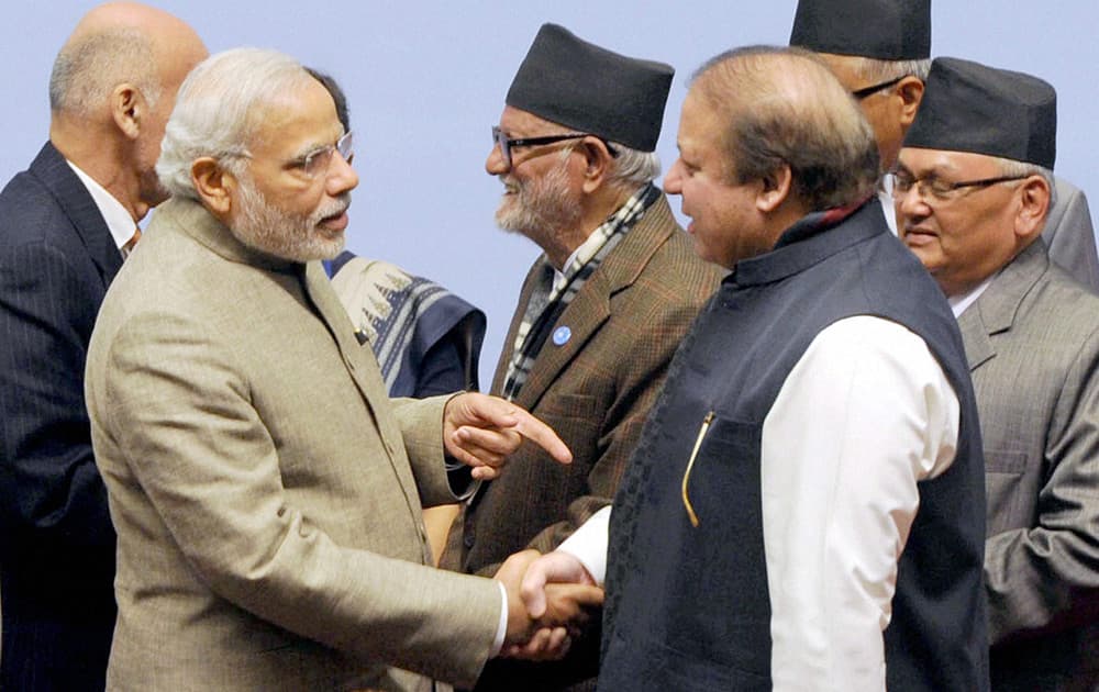 Prime Minister Narendra Modi shakes hands with his Pakistani counterpart Nawaz Sharif at the 18th SAARC Summit in Kathmandu, Nepal.