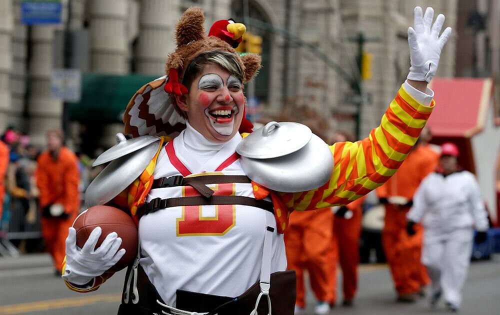 A performer waves at the crowd during the Macy's Thanksgiving Day Parade, in New York.