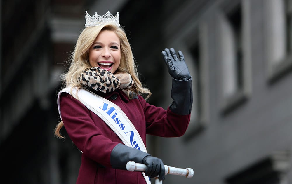 Miss America Kira Kazantsev waves to spectators during the 95th annual Thanksgiving day parade, in Philadelphia.