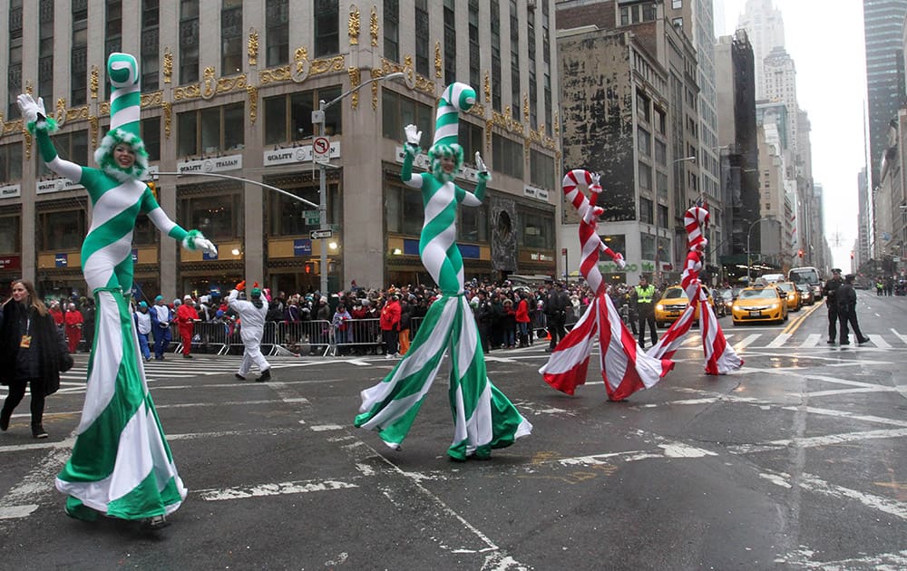 Parade participants dressed as candy canes make their way down New York's Sixth Avenue during the Macy's Thanksgiving Day Parade, in New York.