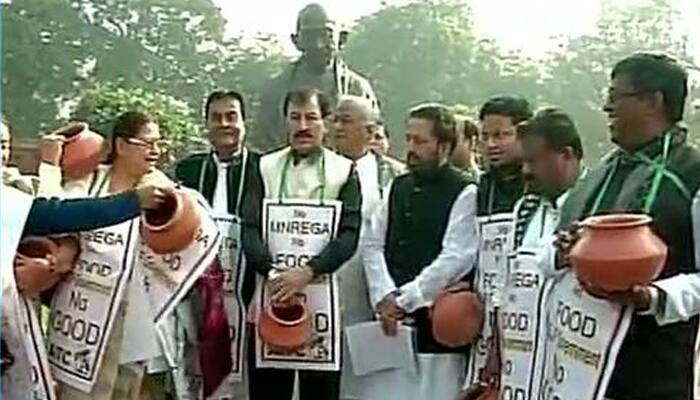 After umbrellas and black shawls, TMC MPs now protest with earthern pots in Parliament