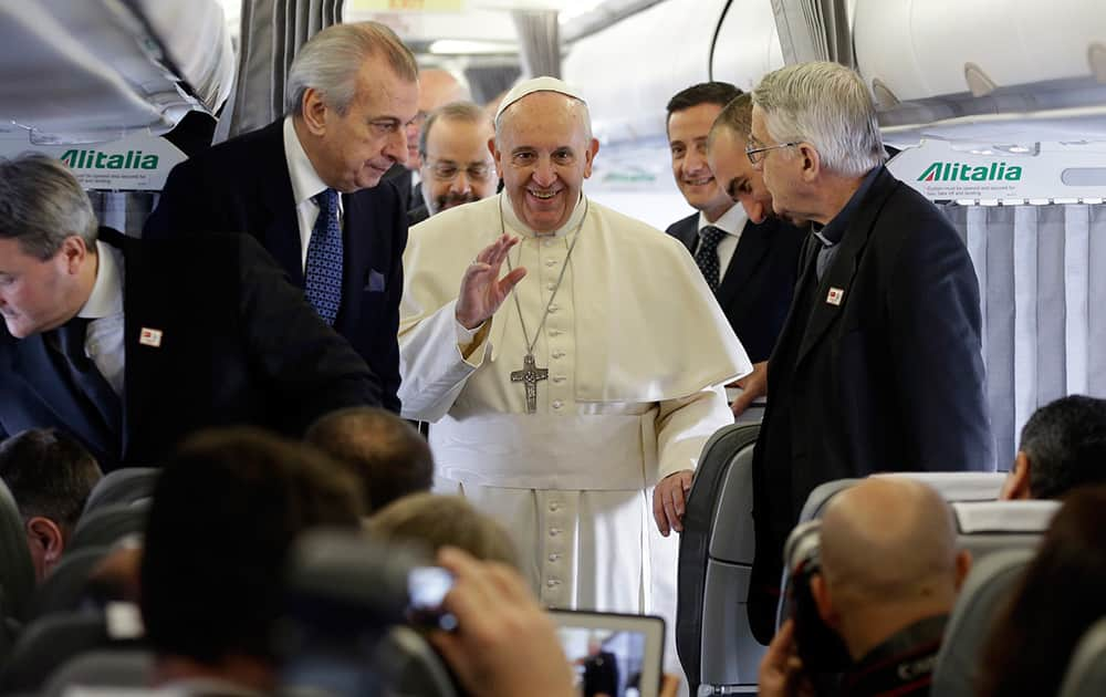 Pope Francis talks to journalists during a press conference aboard the flight towards Ankara. Pope Francis travels to Turkey this weekend amid new Muslim-Christian tensions and a violent war next door, with Islamic State militants seizing chunks of territory in Iraq and Syria and sending 1.6 million refugees across the border into Turkey.