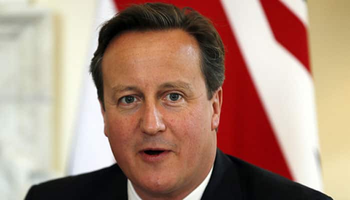 David Cameron urges migrant curbs, warns on British EU exit
